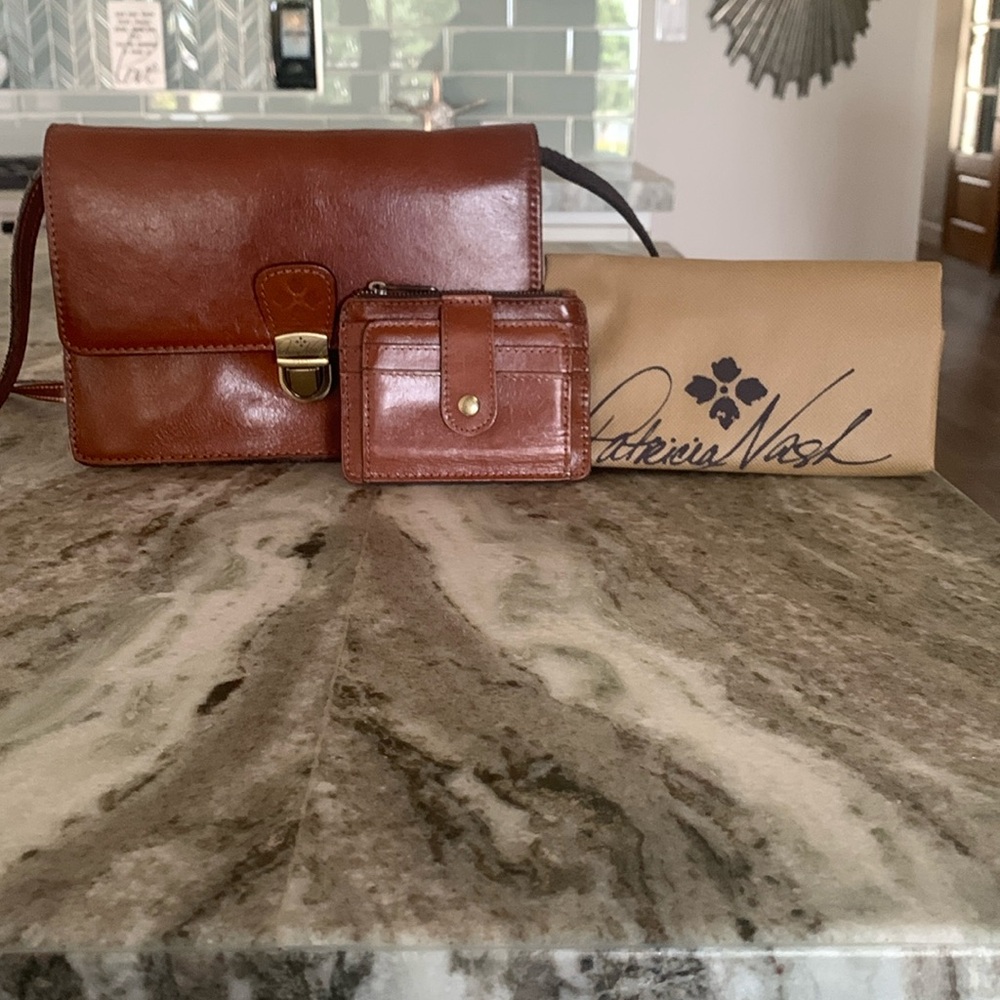 Classic Brown Leather Crossbody Bag with Gold Clasp and matching wallet.
